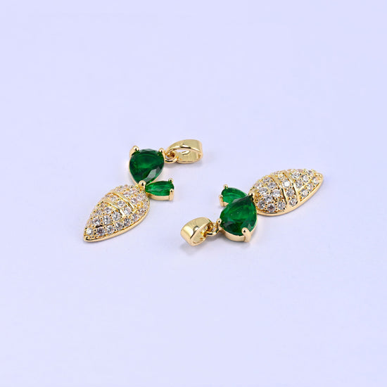 A carrot rendered entirely in clear zircon pave, tapering to a point, with three green pear-cut stones set as the leafy top. Playful, but finished to the standard of a proper stone-set pendant.