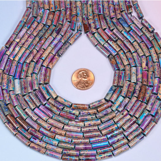Multicolor Sea Sediment Jasper tube beads featuring purple, magenta, turquoise and deep blue over a tan mineral-veined base.