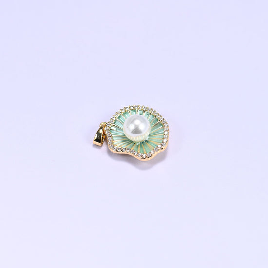 Shell charm with a faux pearl center and a clear zircon border