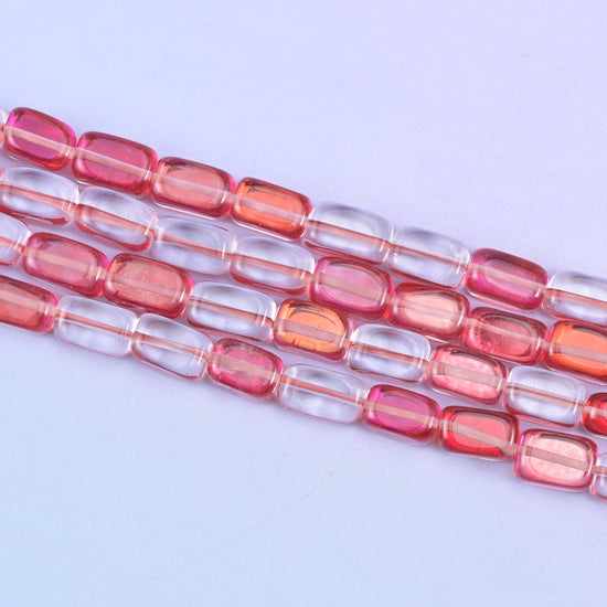 Red Mystic Aura glass beads in a vivid rosy-red shine with a subtle iridescent glow