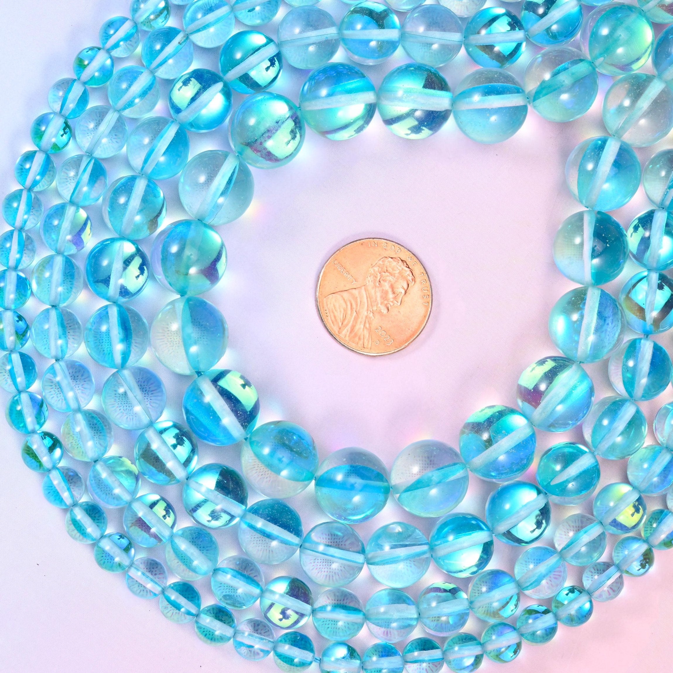 Iridescent Light Blue Round Glass Beads, sold per 15 inch strand