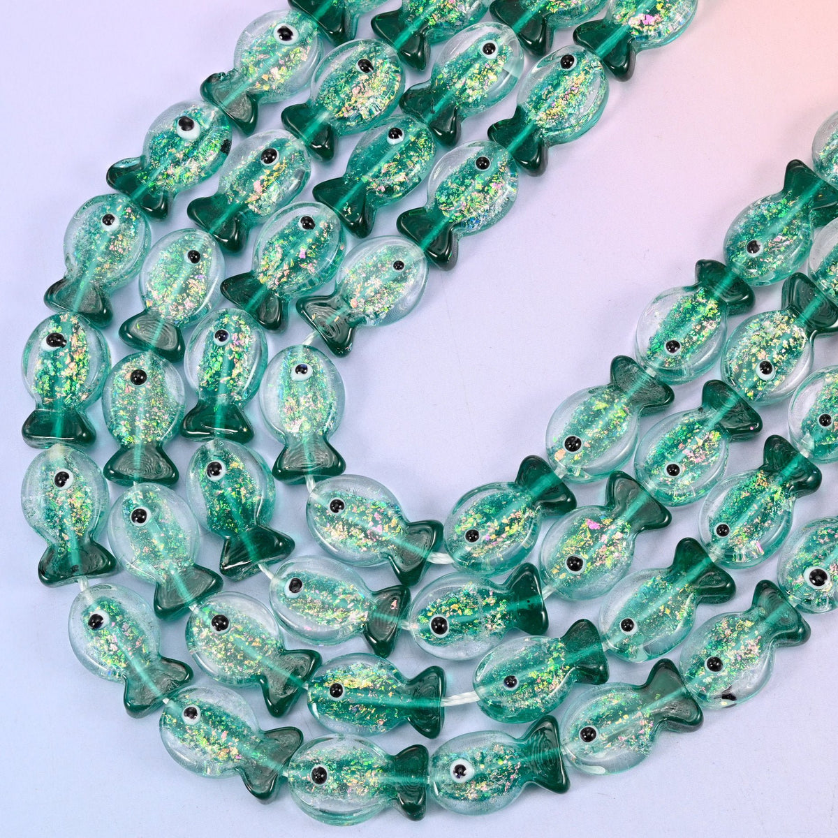 Iridescent Green Fish Glass Beads, 15.5 inch strand