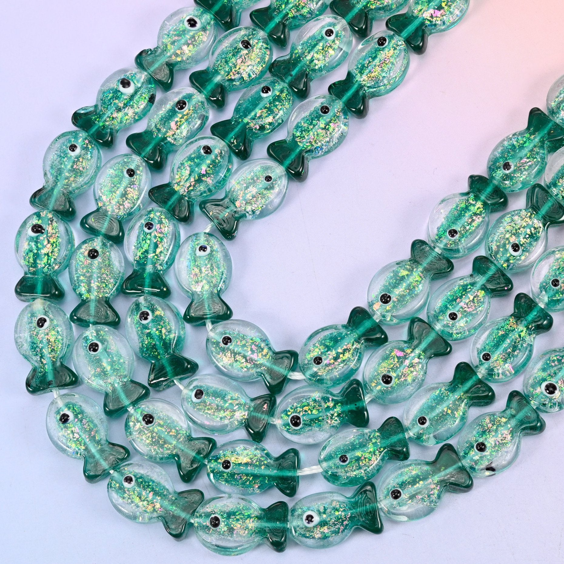 Iridescent Green Fish Glass Beads, 15.5 inch strand