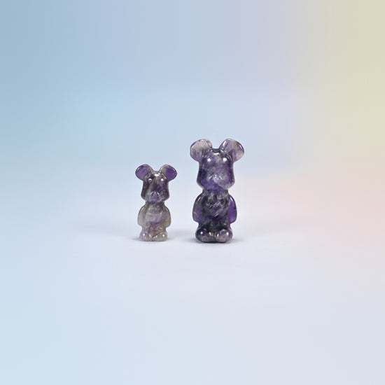 A 1.5 inch and a 2 inch amethyst power bear crystal carving, purple and white natural stone