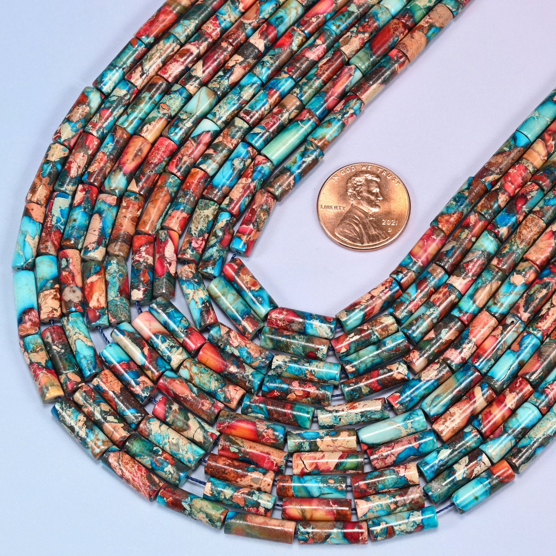 Tube cut Sea Sediment Jasper beads, dyed for vibrant multicolor saturation.