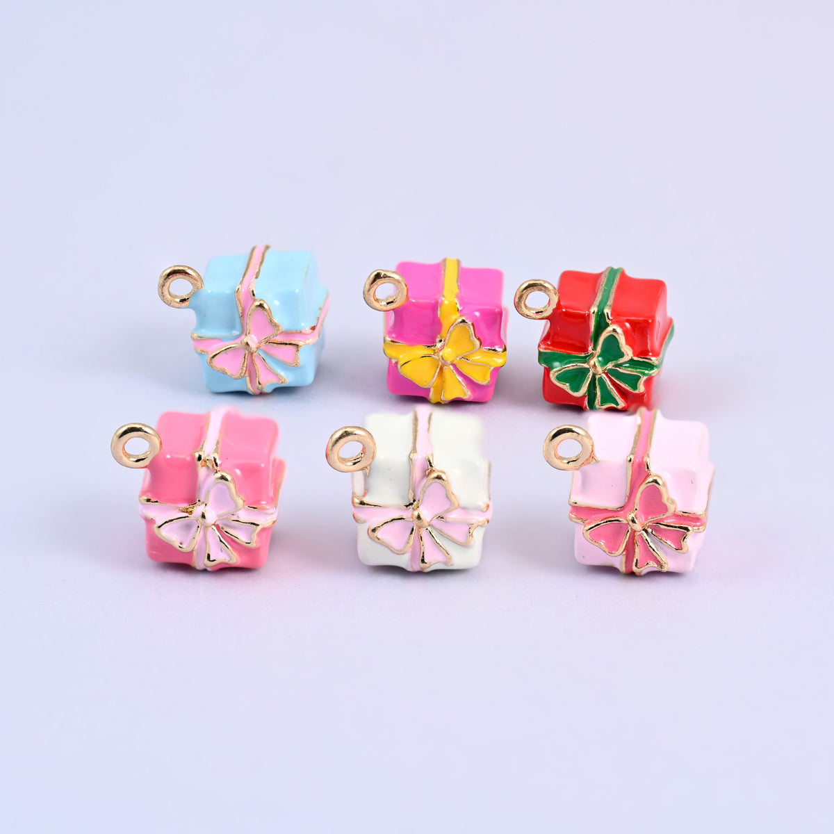 All six gift box colorways in two rows: light blue, pink, red, pink, white and light pink.