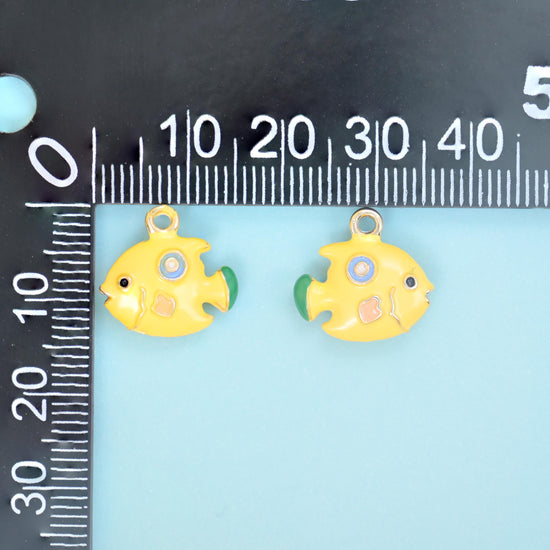 Glossy buttercup-yellow enamel over an 18K gold filled brass body, finished with mint-green fins and tail and a soft pink cheek