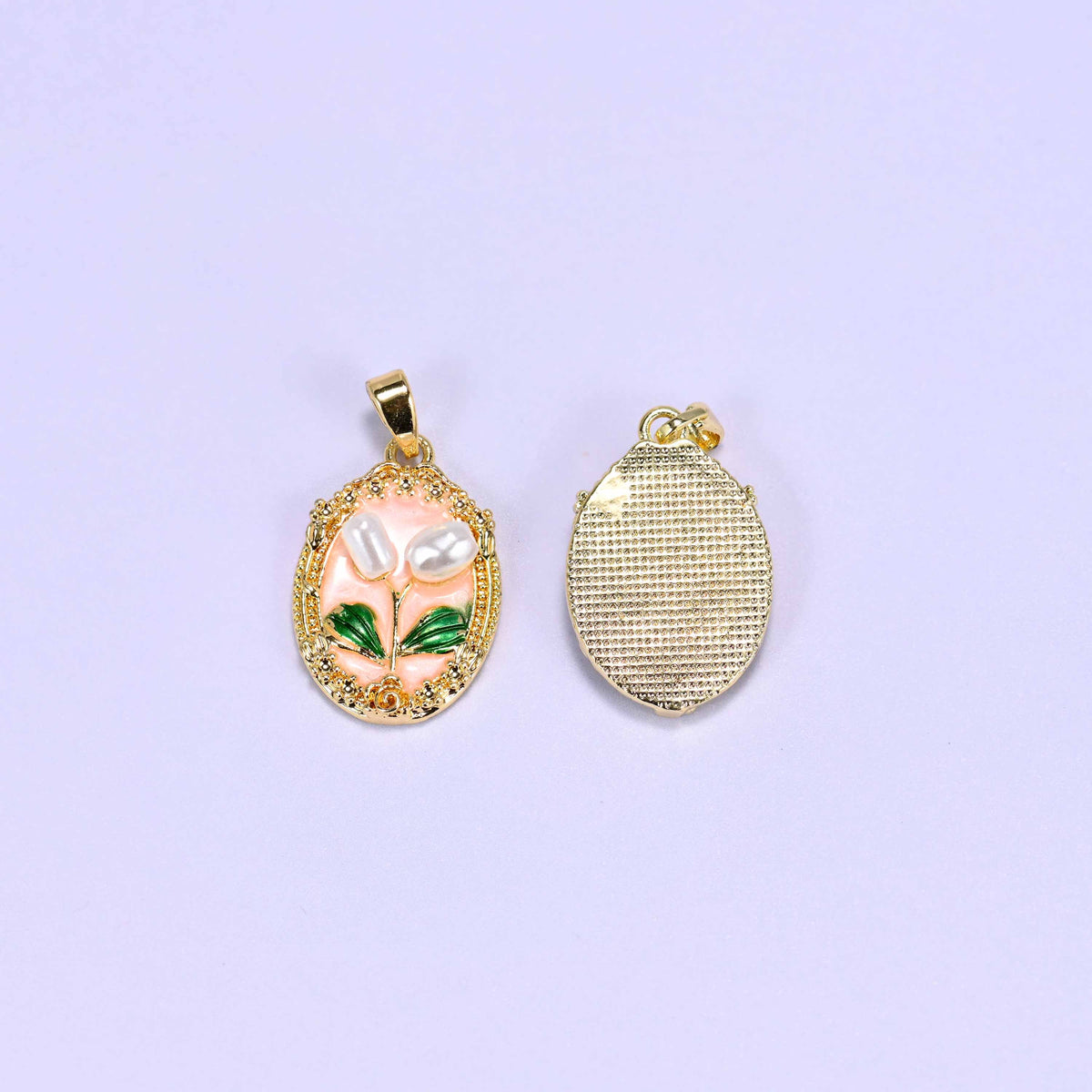 Enamel Oval Tulip Flower Pendants front and back, the peach enamel face beside the plain cross-hatched gold plated reverse.