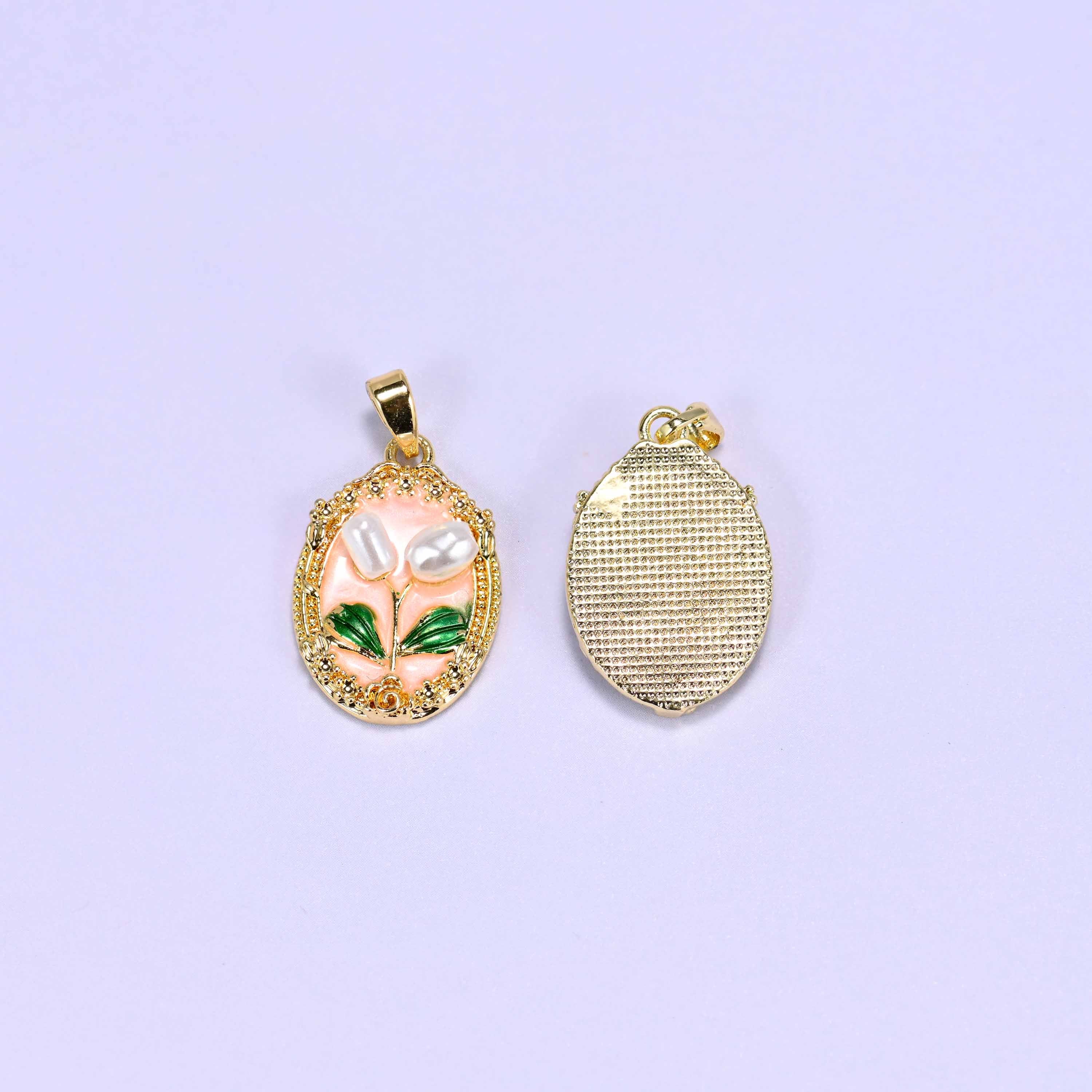Enamel Oval Tulip Flower Pendants front and back, the peach enamel face beside the plain cross-hatched gold plated reverse.