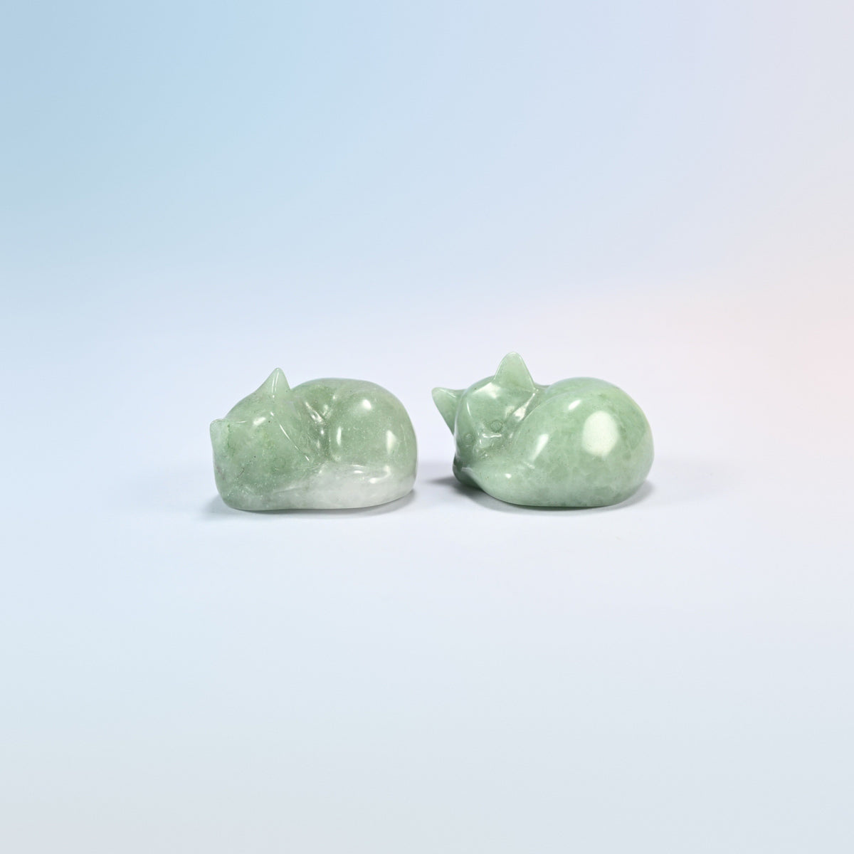 Two natural green aventurine sleeping cat crystal carvings, 1.5 inch