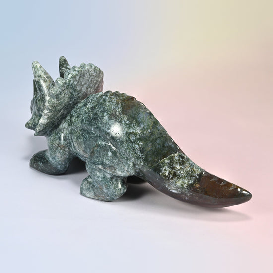 Rear view from the left of the Indian agate triceratops carving, speckled green and white agate