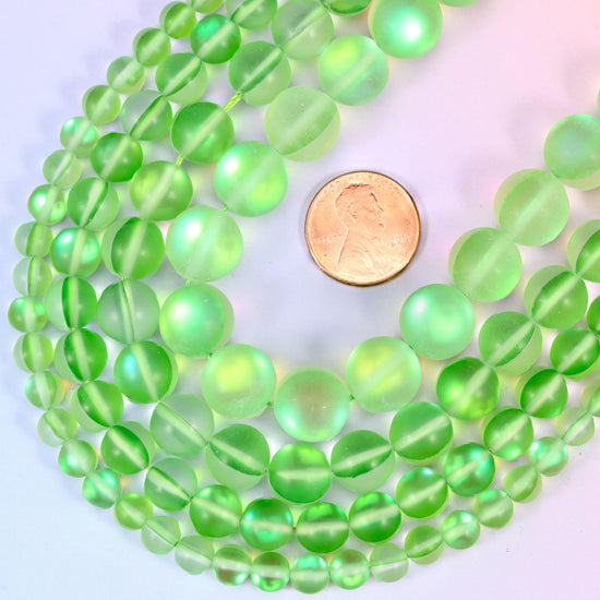 Round matte frosted light green glass beads with iridescent coating