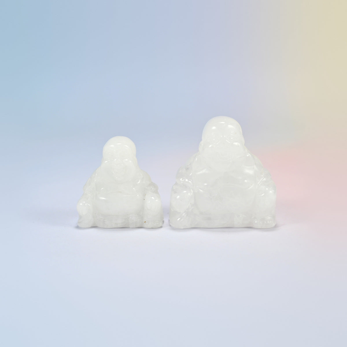 A 1.5 inch and a 2 inch clear quartz laughing Buddha crystal carving, milky clear natural stone