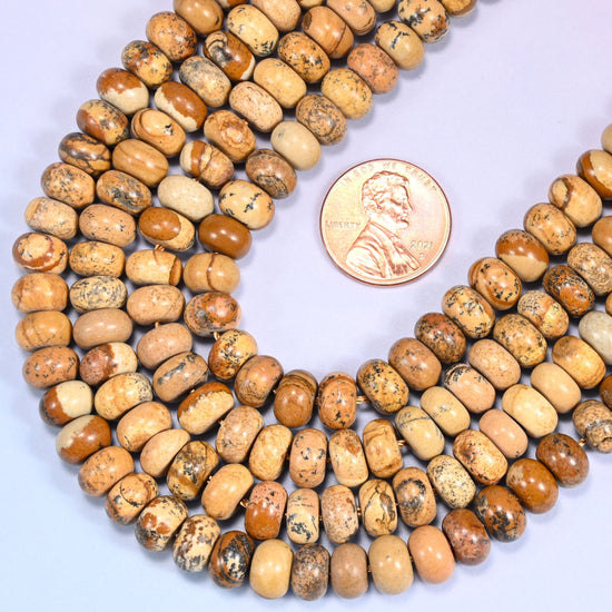 Rondelle cut Natural Picture Jasper beads with natural banding and mineral inclusions.