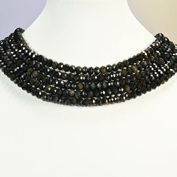 Gold Obsidian gemstone rondelle beads 4x6mm shown on a white neck display as a layered necklace