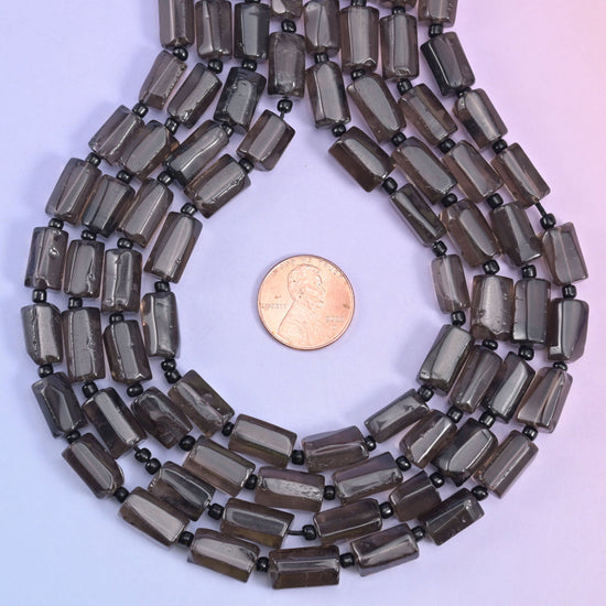 Natural Smoky Quartz faceted tube cylinder beads with deep, earthy natural translucency.