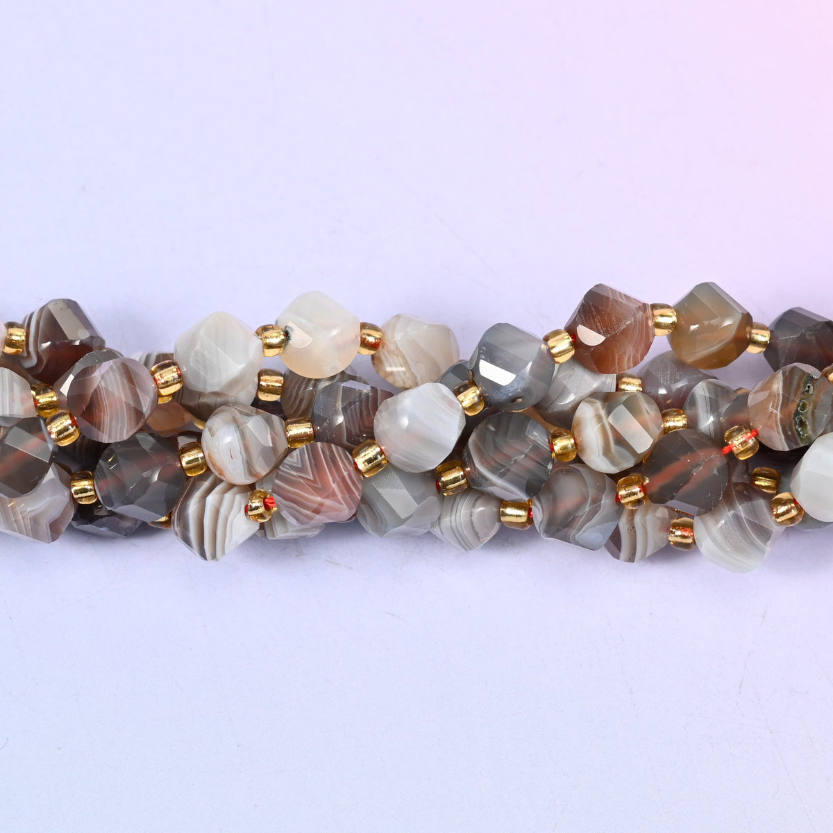 Botswana agate natural stone beads in a 15 inch strand, colour running from soft grey to deep red-brown