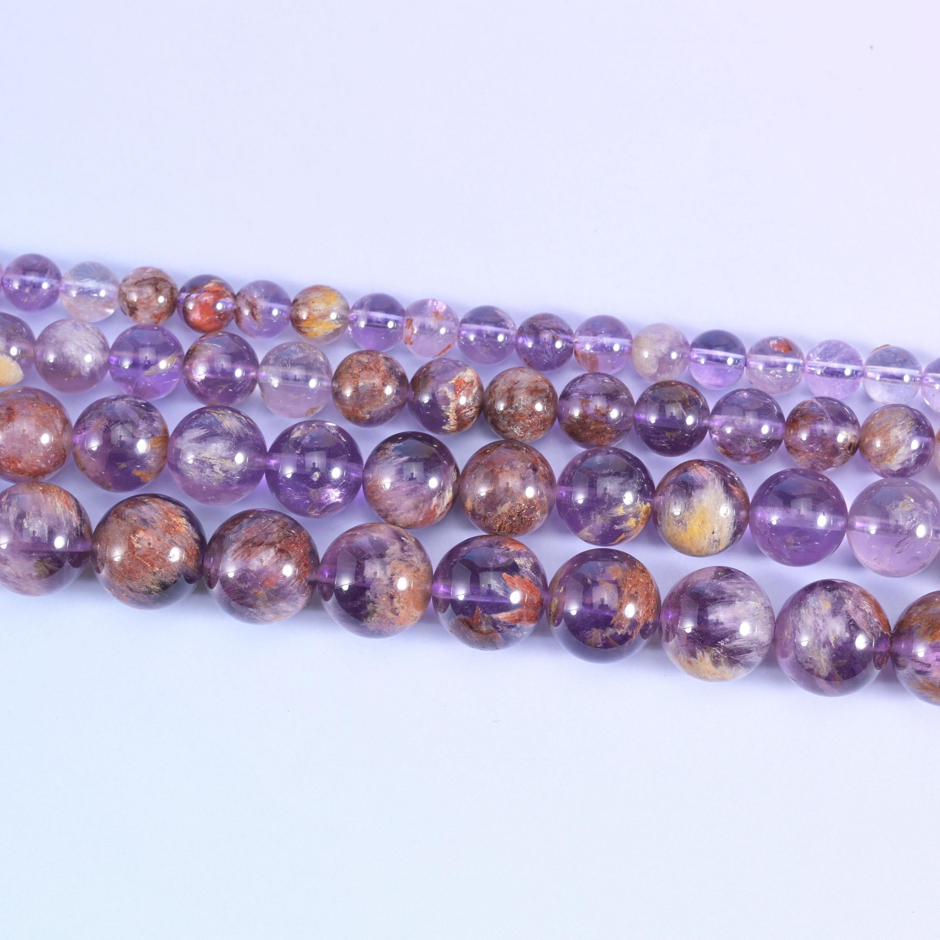 Super 7 purple phantom round beads in translucent lilac to grape