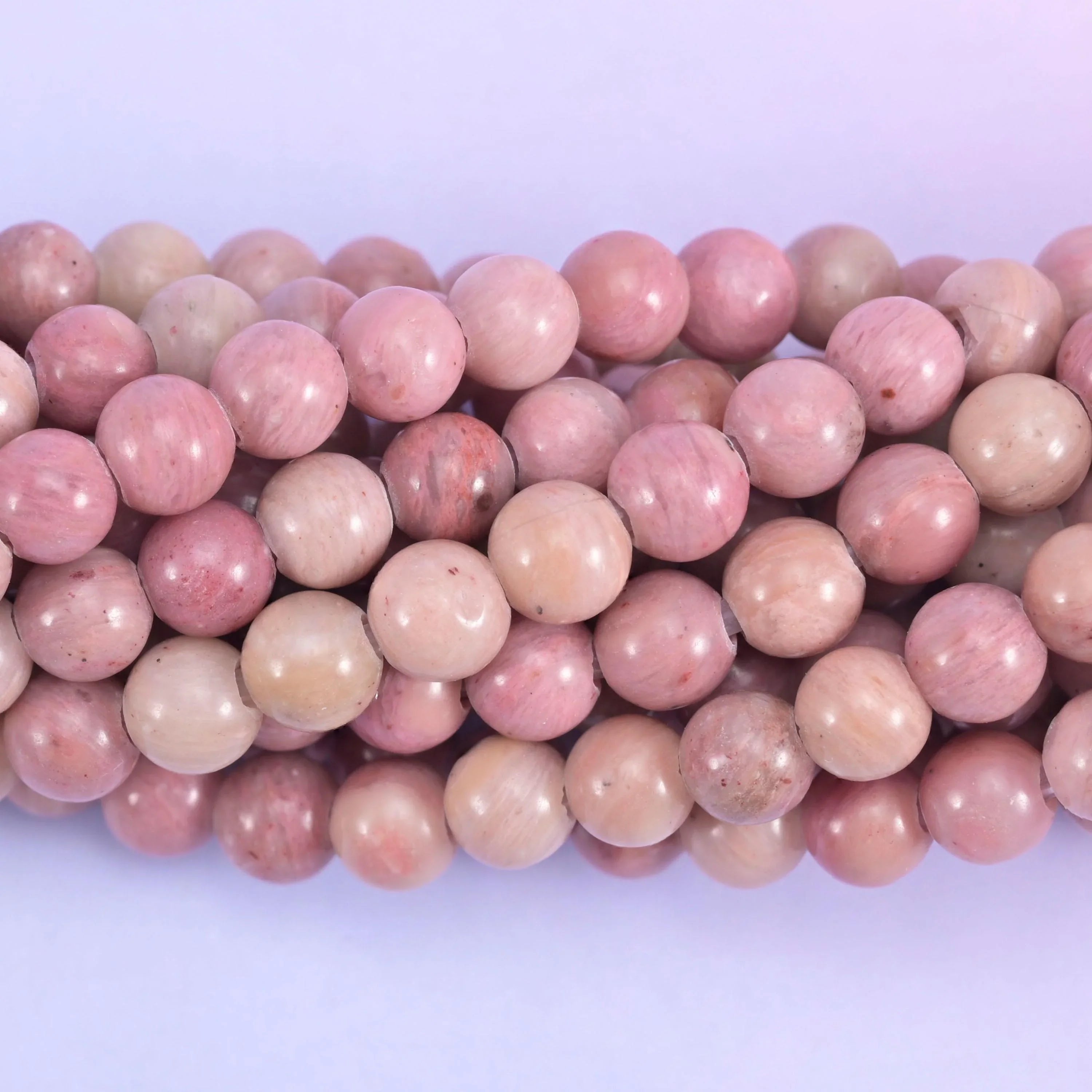 Smooth round cut pink rhodonite beads