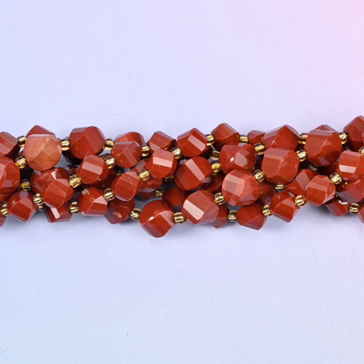 Red Jasper Faceted Spiral Twist Beads, approximately 38 beads at 8mm and 31 at 10mm per strand.