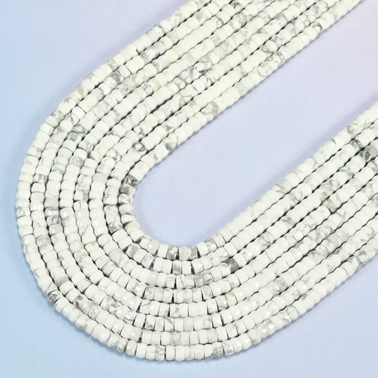 White howlite faceted heishi disc beads in several strands curved into a wide U, white stone with gray veins