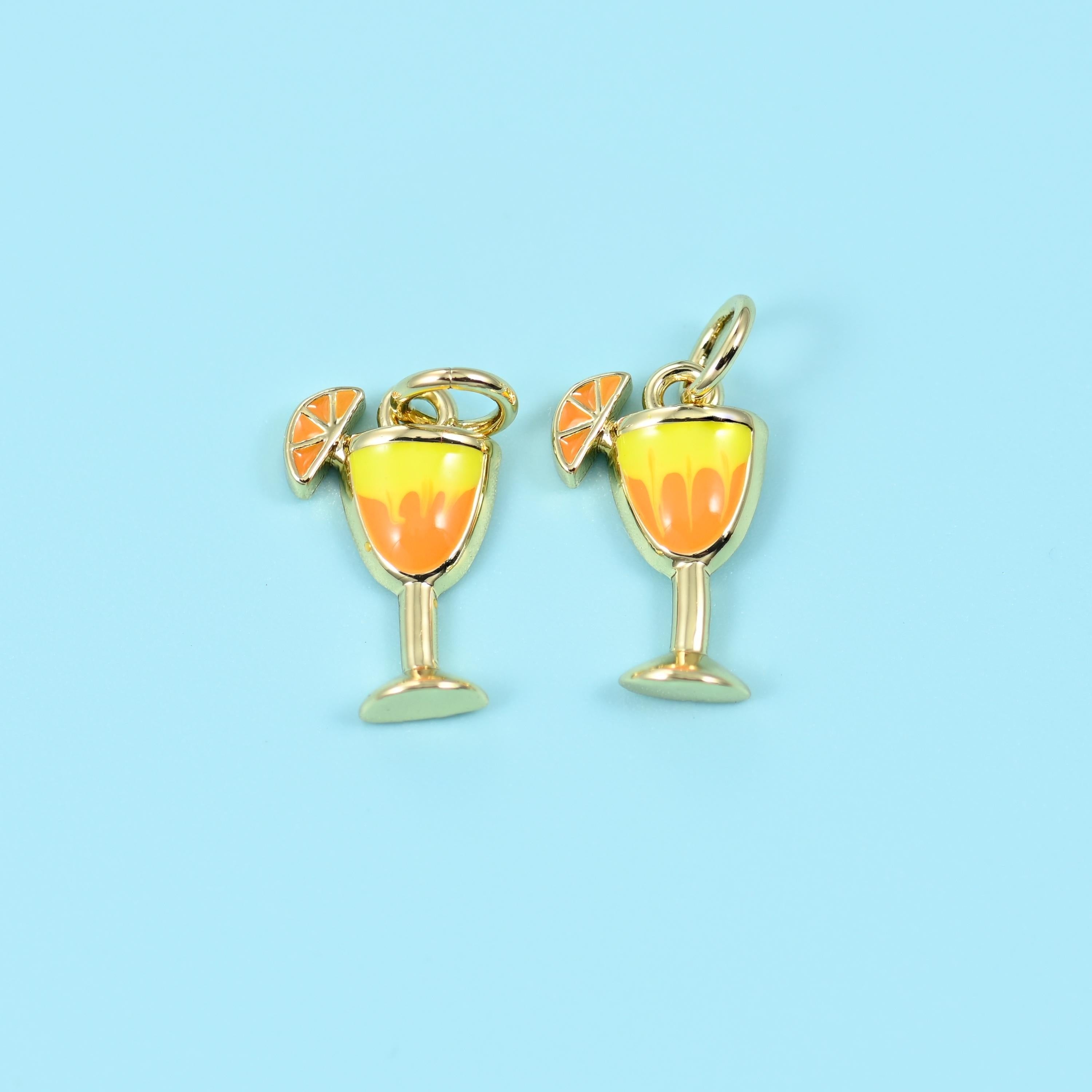 Cocktail glass with an orange slice cut brass beads