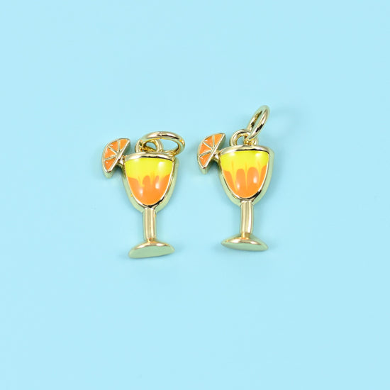 Cocktail glass with an orange slice cut brass beads