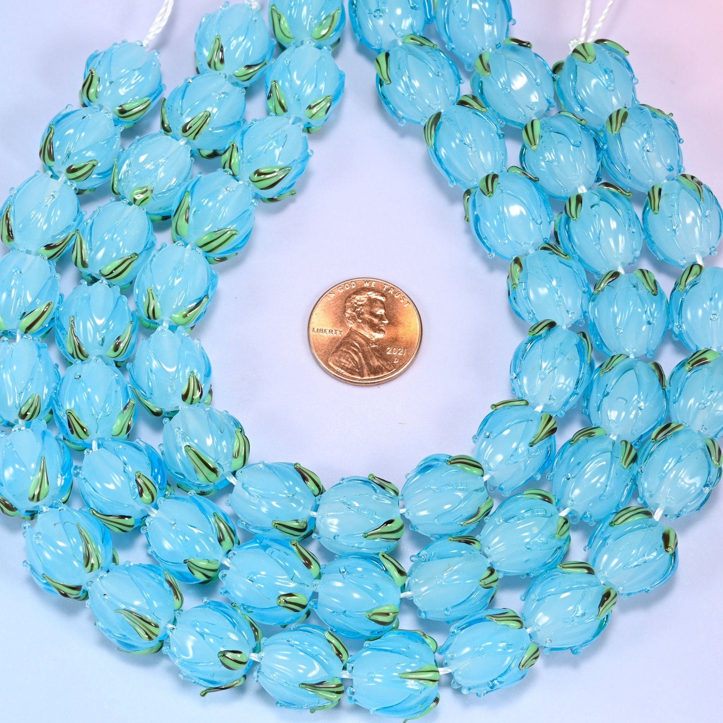 Sky blue tulip flower bud lampwork glass beads, approximately 20 beads per strand