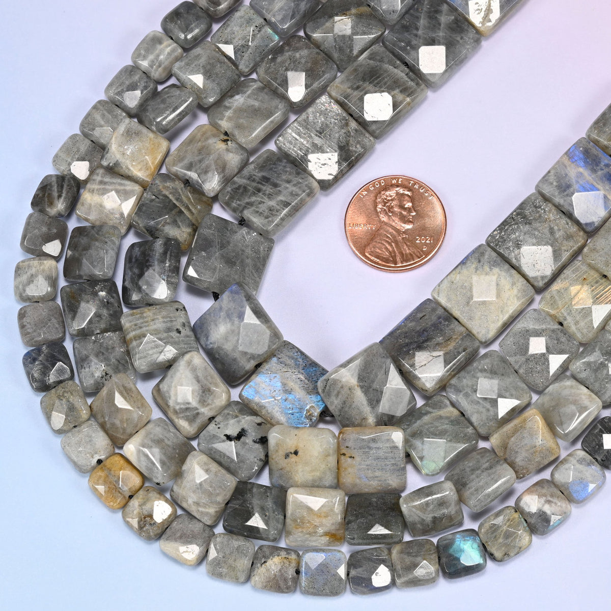 Gray Labradorite faceted flat square beads in a deep loop, shown at their true size of 8mm to 14mm