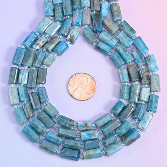 A sleek, polished tube shape with natural color variation, perfect for handmade jewelry designs