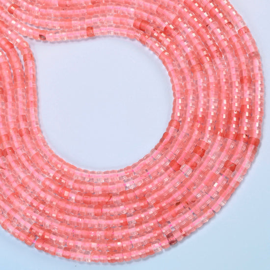 Melon quartz faceted heishi disc beads curved into an open loop, translucent pink beads with coral pink streaks
