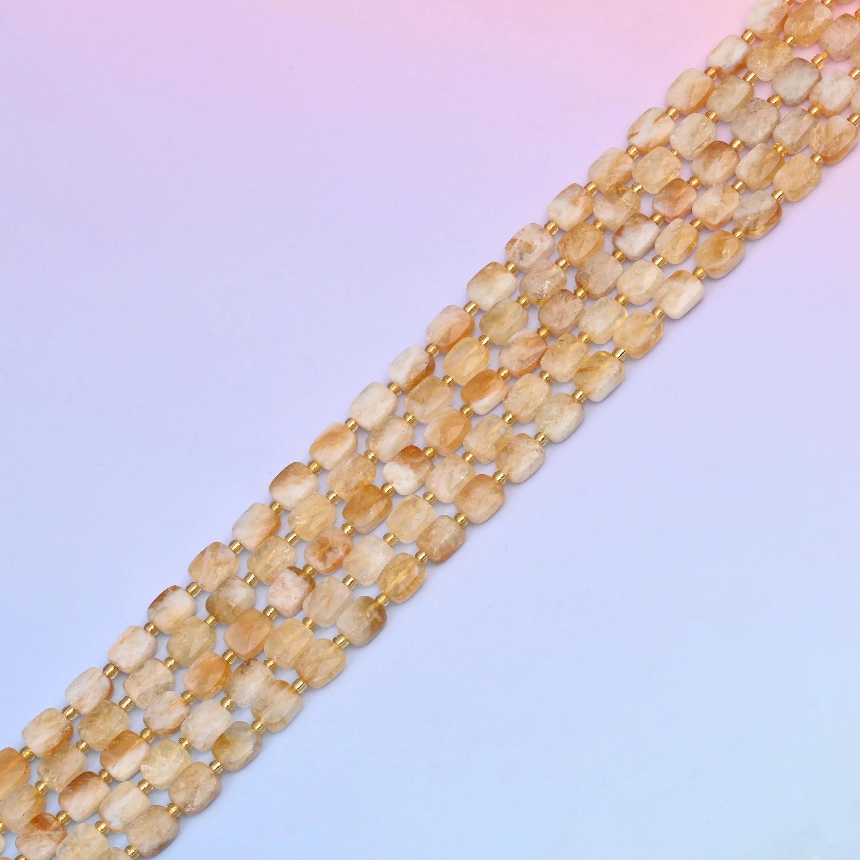 Citrine beads in warm champagne and pale honey tones