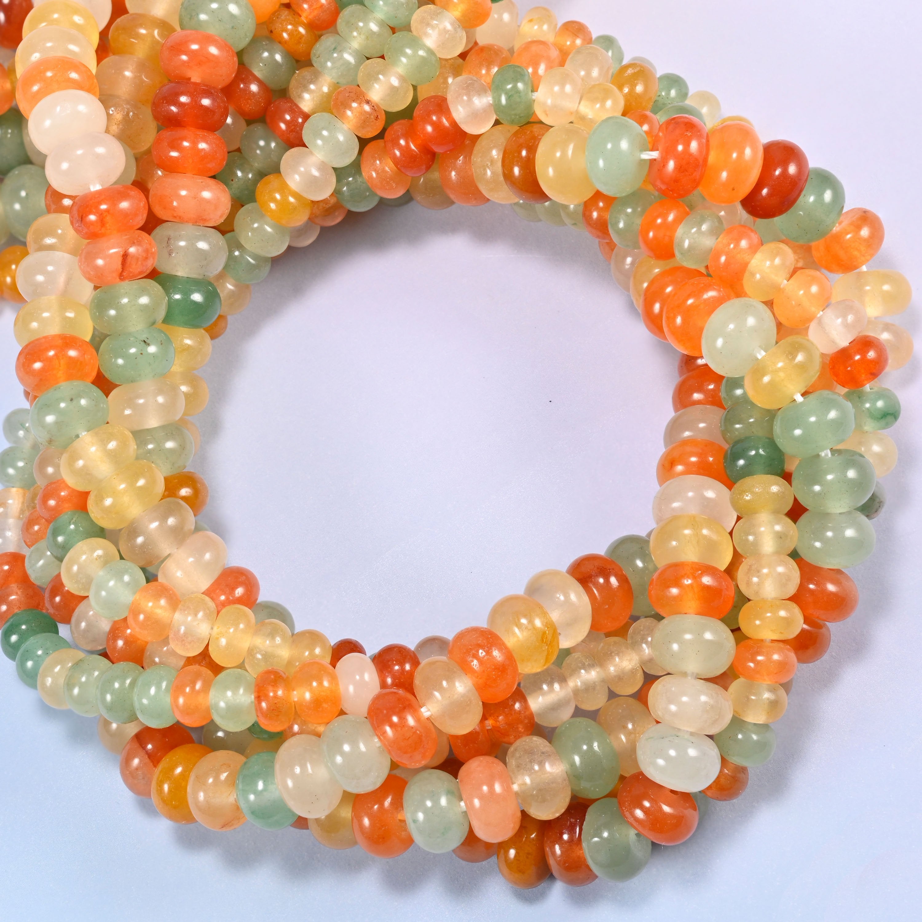 Gold Silk Jade gemstone rondelle beads coiled into a ring, 4x6mm and 5x8mm on 15.5 inch strands