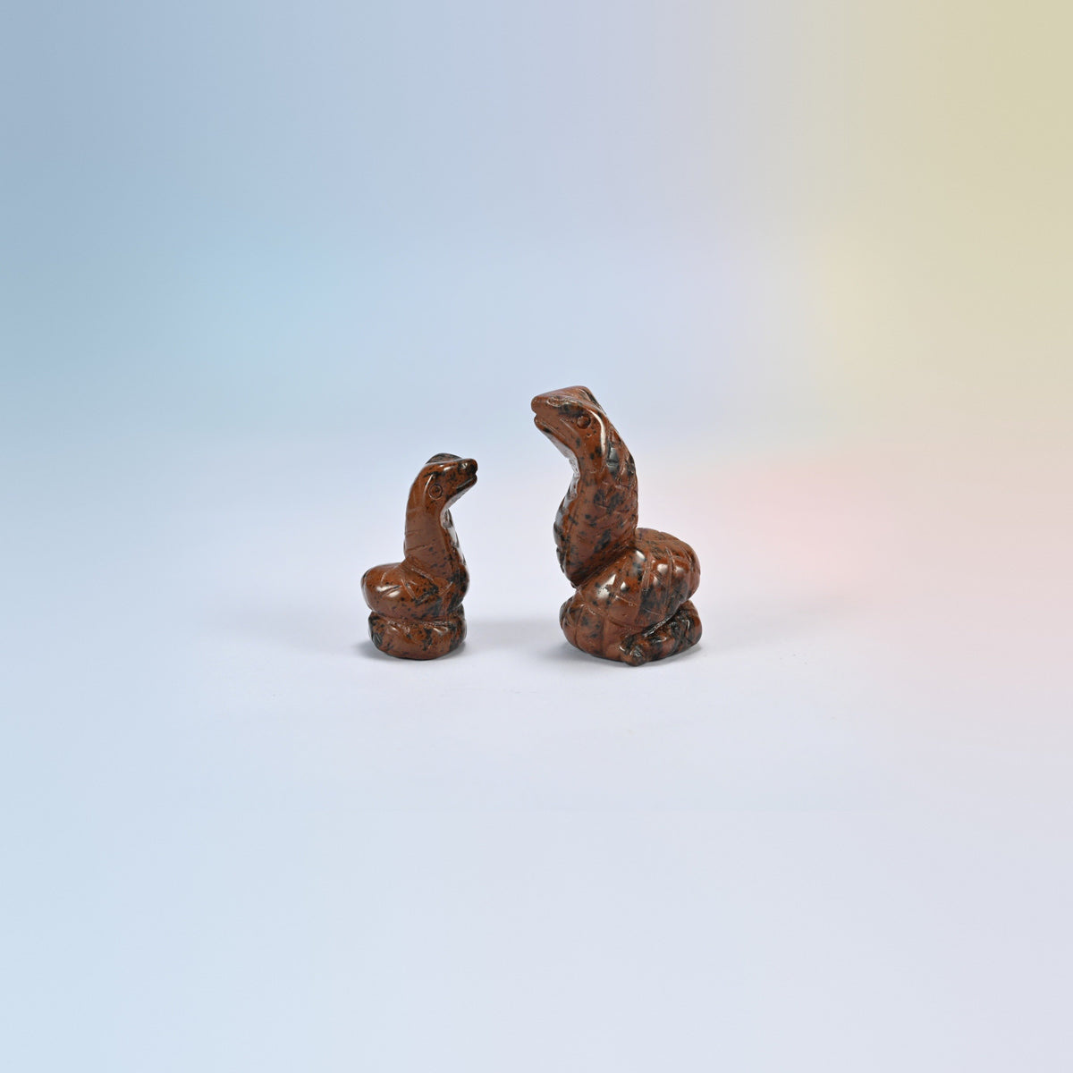 Cobra snake crystal carving in golden swan, gold and brown natural stone