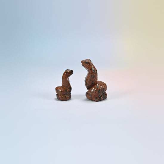 Cobra snake crystal carving in golden swan, gold and brown natural stone