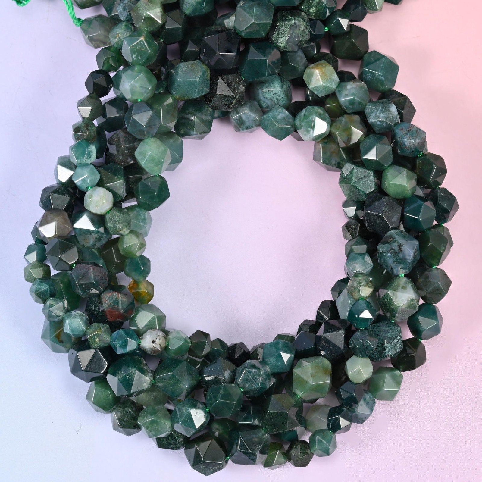 Moss Agate star cut beads coiled in a loop, approximately 38 beads per 10mm strand