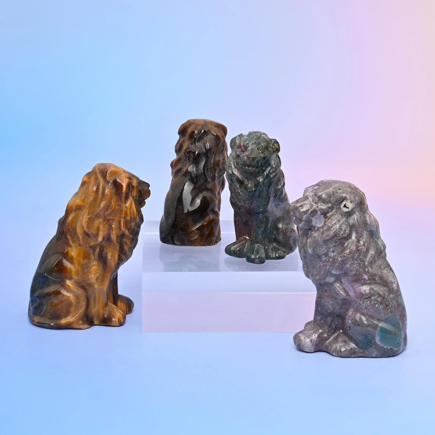 Hand carved and polished seated lion figurine.