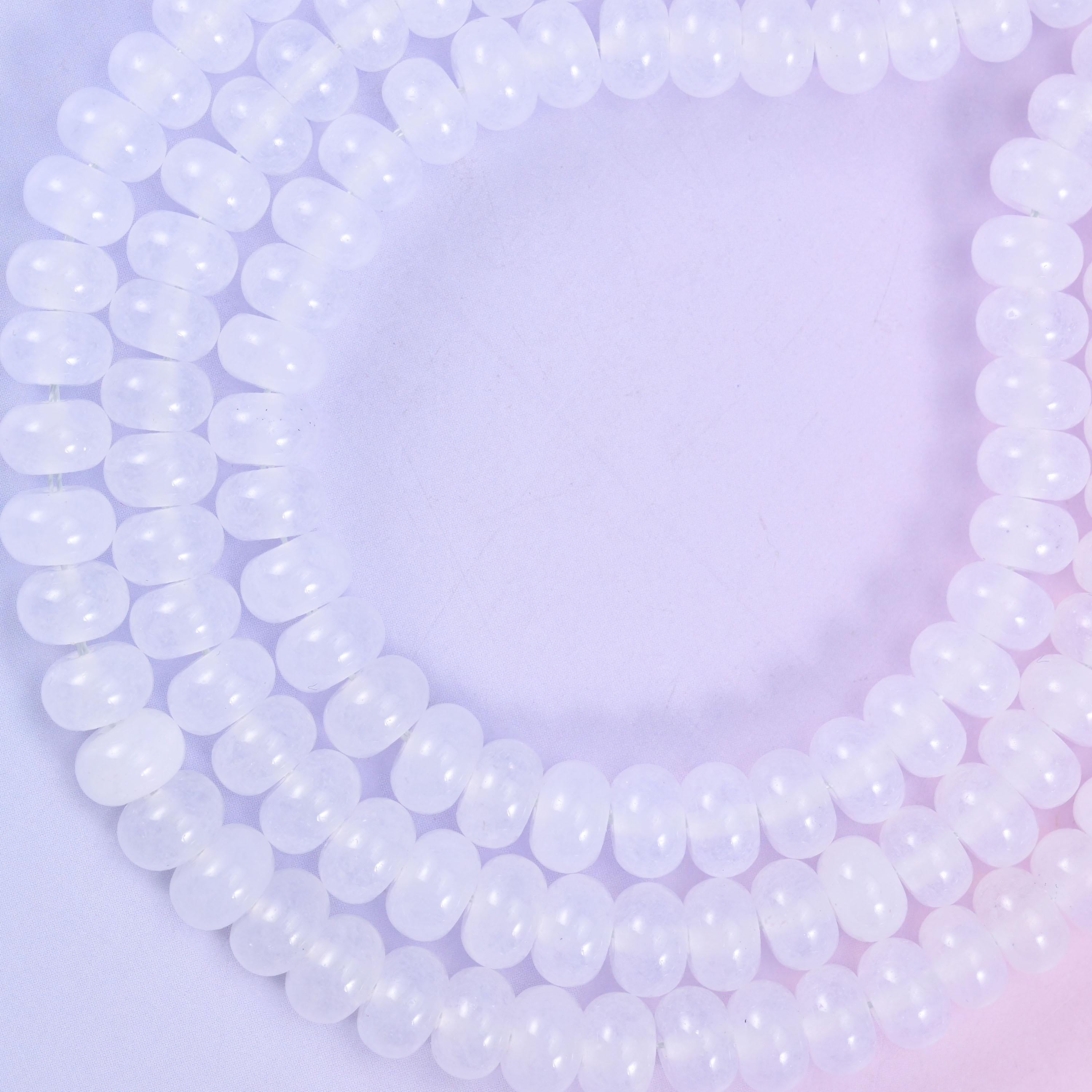 White Dyed Jade smooth rondelle beads in a soft, translucent white, finished with a smooth, polished surface