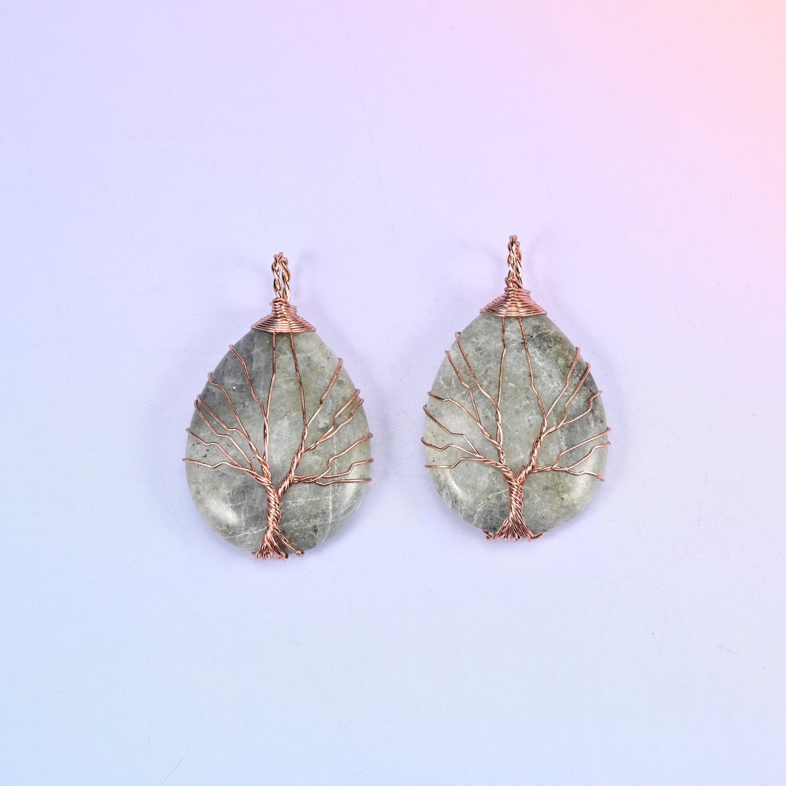 Teardrop Crystal Pendant with Copper Wired Tree in grey-green moss agate, a pair with the cloudy mottling of the stone visible through the wire.
