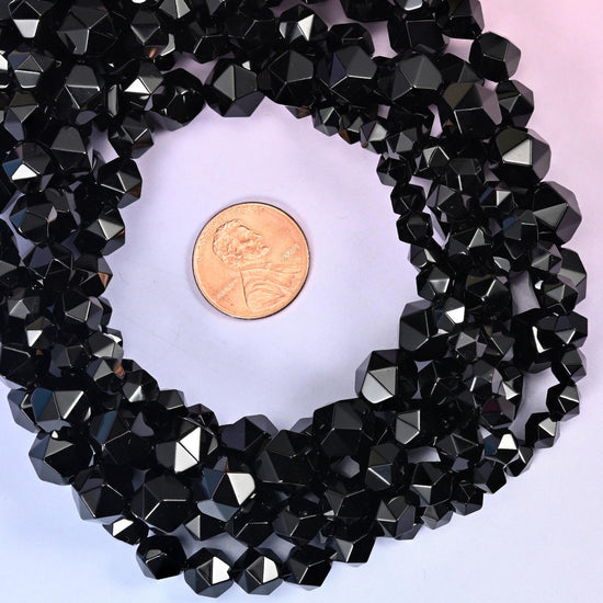 Black Onyx beads coiled around a US penny, hole size approximately 1.0mm, natural stone in solid black