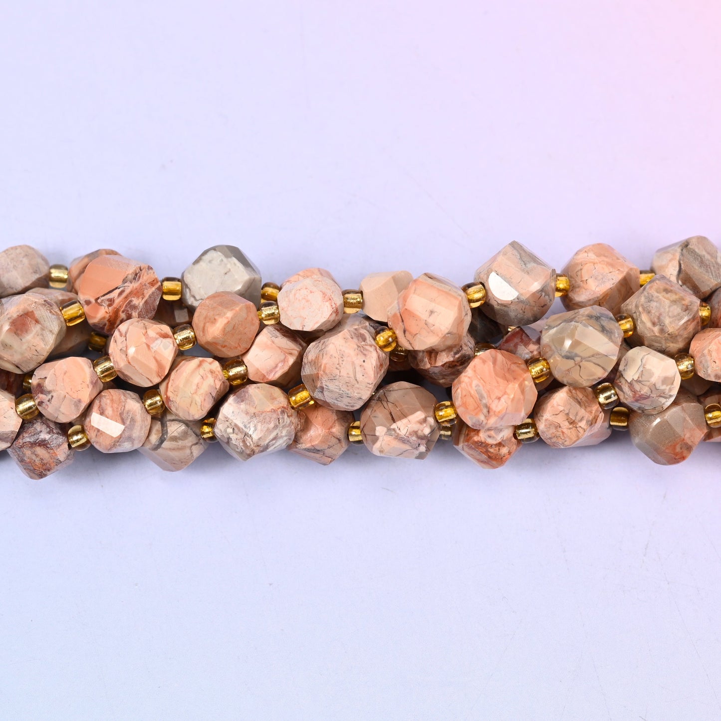 Red Howlite Faceted Spiral Twist Beads, warm peachy terracotta and soft beige marbled with fine grey veining