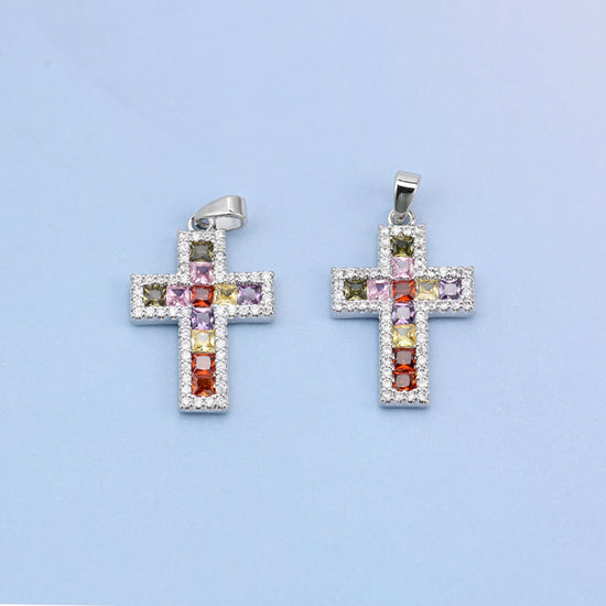 Zirconia cross charms, two white gold plated pendants shown front on with multicolour stones