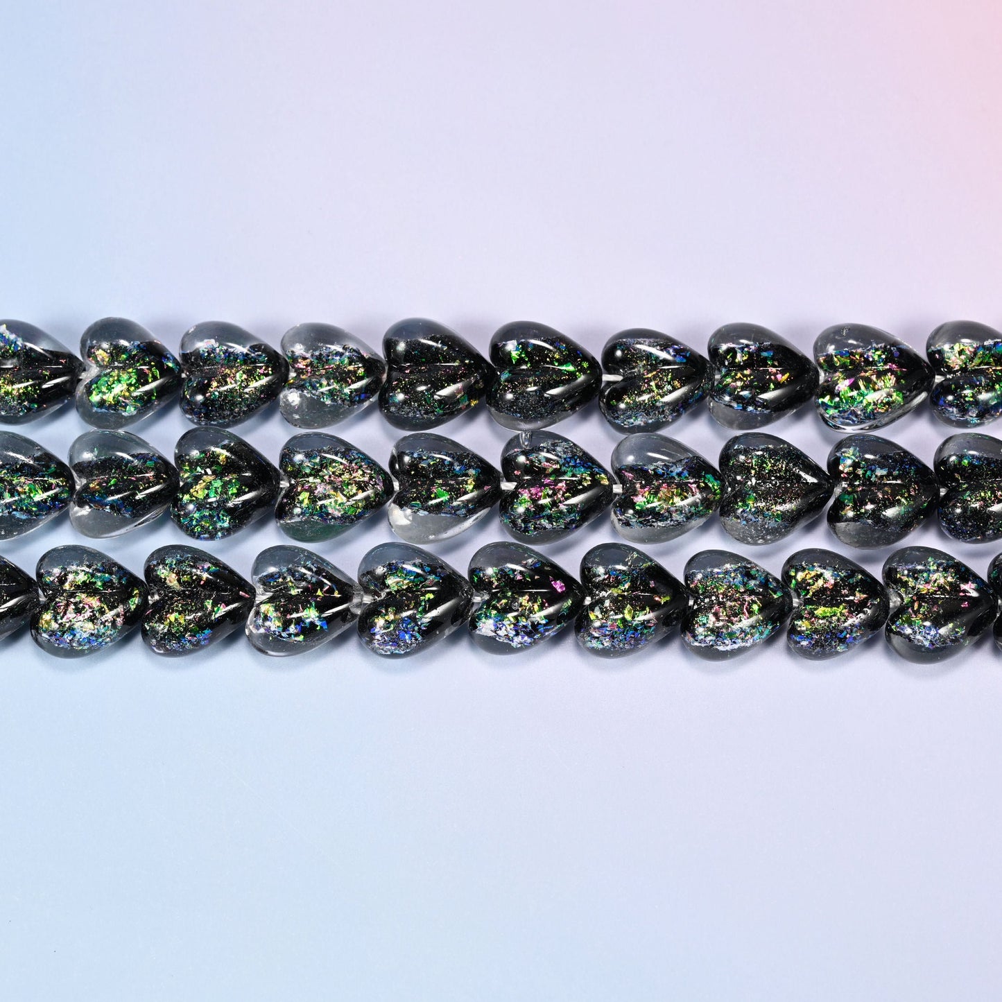 Iridescent Heart Glass Beads in near-black with emerald and violet flecks