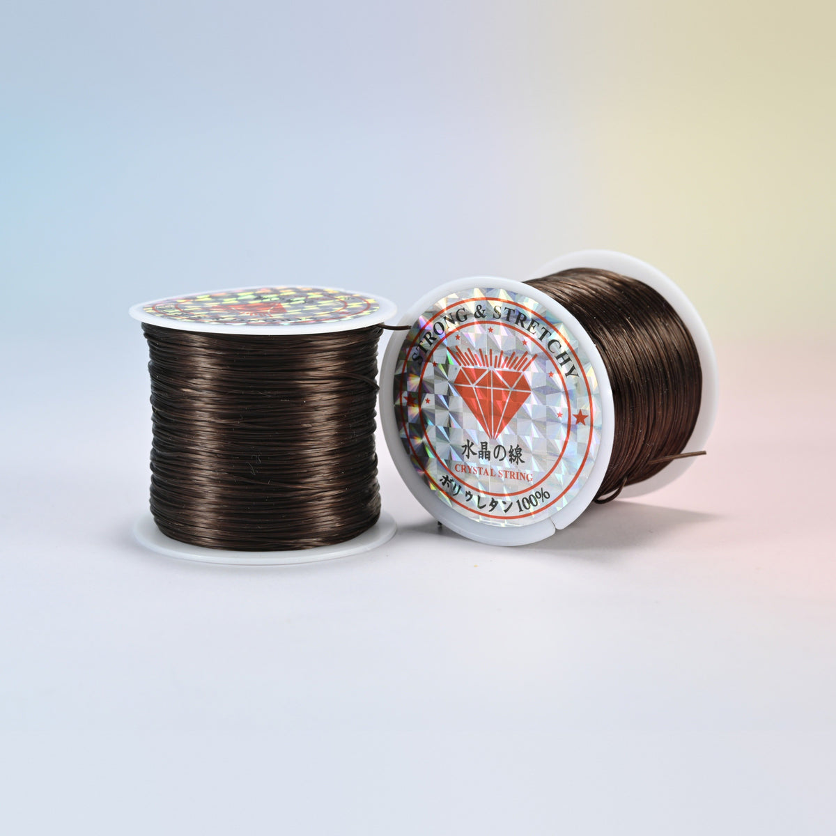 Two rolls of dark brown 0.7-0.8mm elastic stretch string, glossy polyurethane bead cord with a holographic label