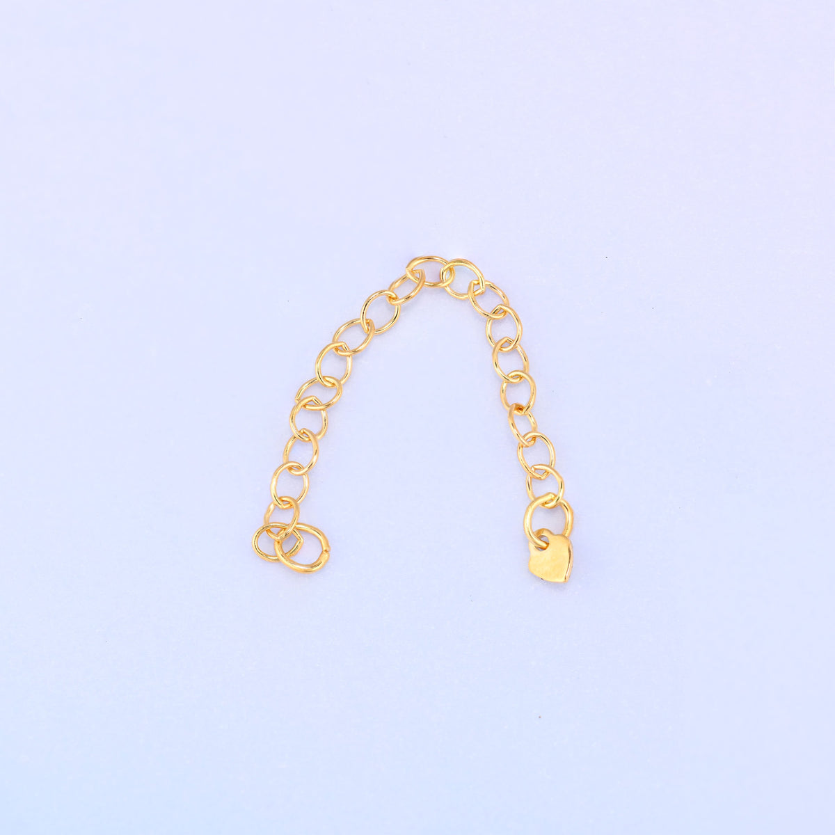 14K gold filled heart chain extender arranged in an arch, jump ring loop on one side and heart charm on the other.
