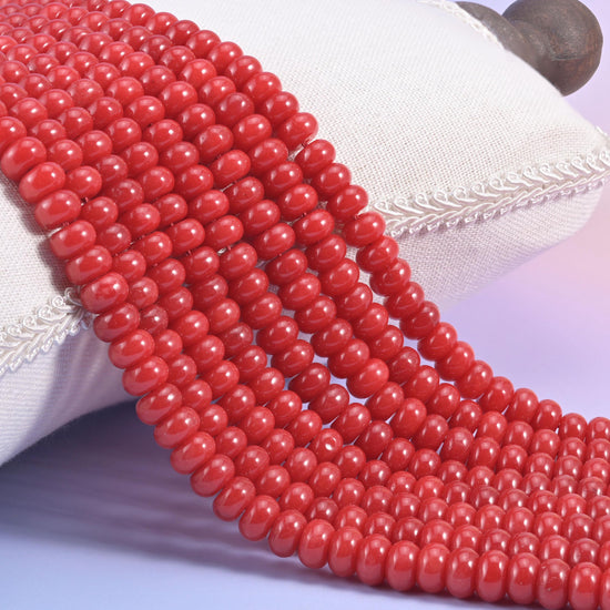 Red Dyed Jade smooth rondelle beads in a bold, glossy cherry red