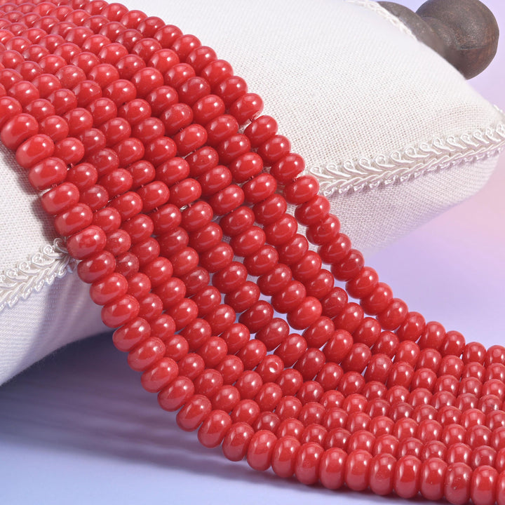Red Dyed Jade smooth rondelle beads in a bold, glossy cherry red