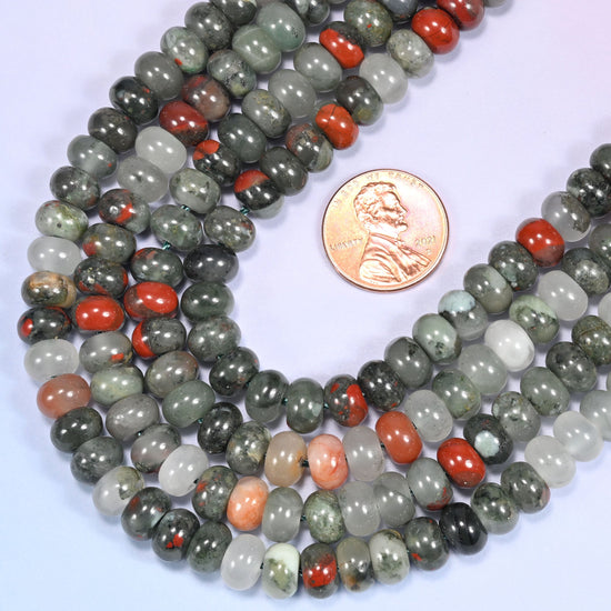 Close-up of African Bloodstone round beads coiled in a circular arrangement on a lavender background.