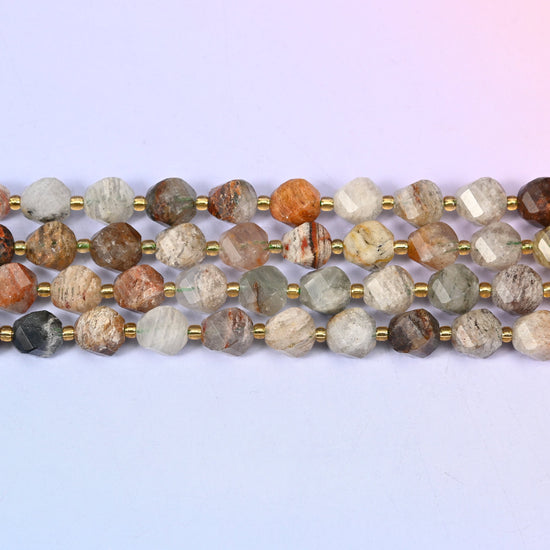 Thousand Layer Phantom Quartz natural crystal beads running from nearly clear to densely packed with red-brown and moss green inclusions