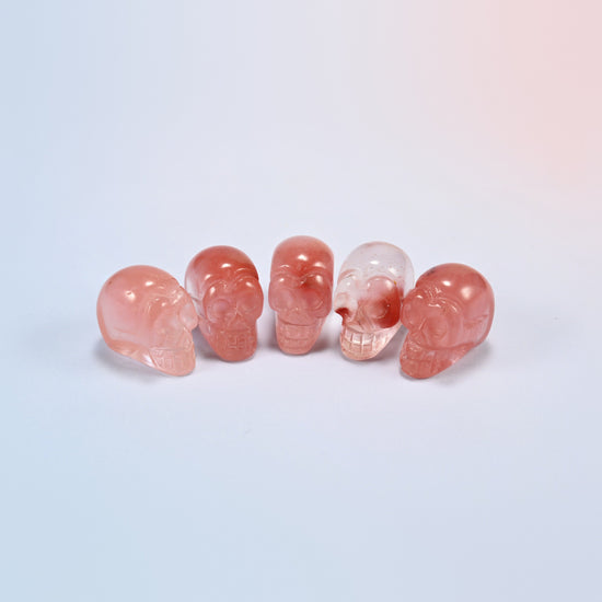 1 inch skull crystal carving in watermelon quartz, pink-red man-made glass